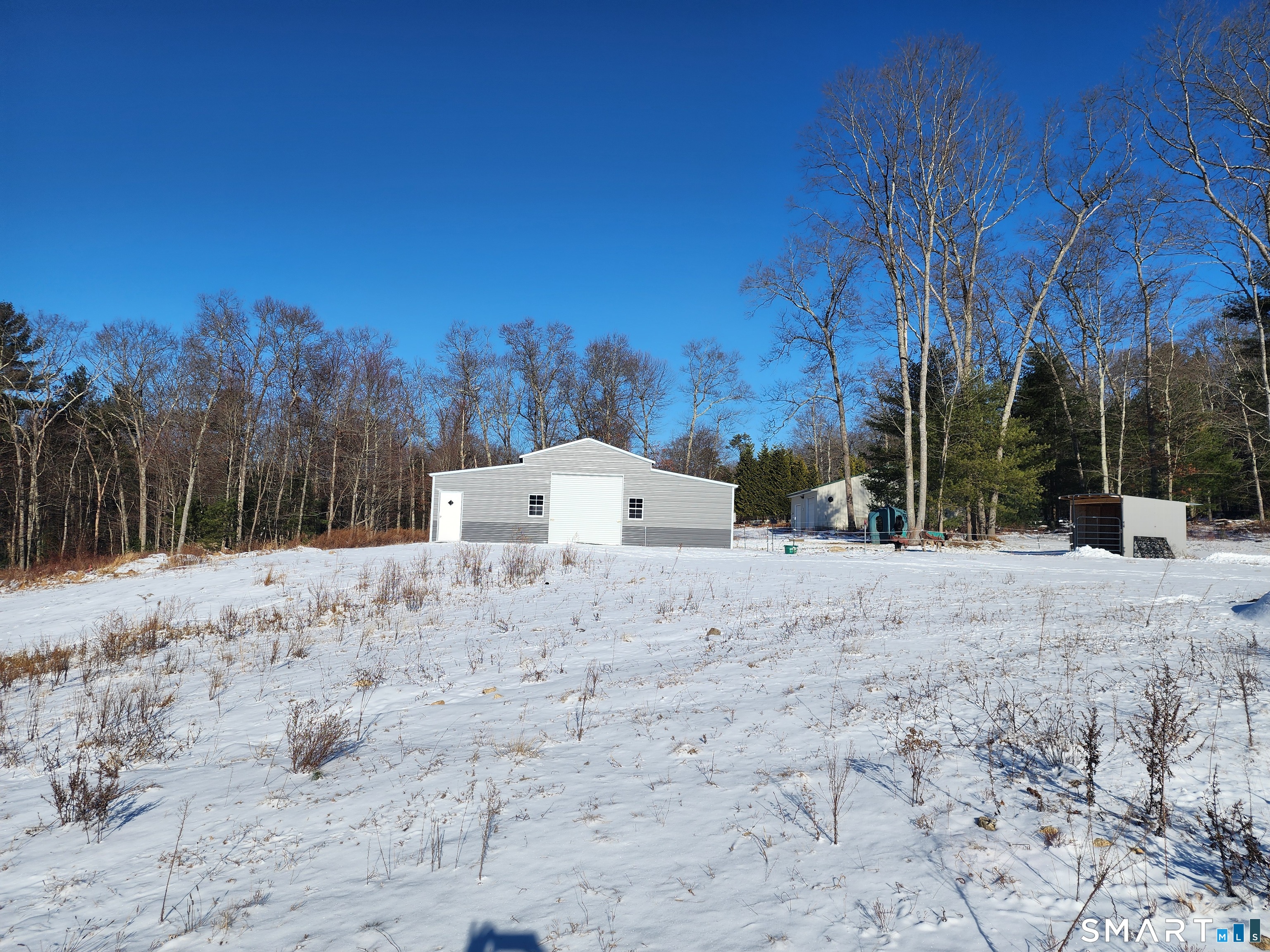 95 Old Breakneck Road Killingly, CT 06241 - Photo 37 of 39 a view of white house with a snow in the background