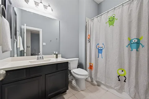 a bathroom with a sink and toilet