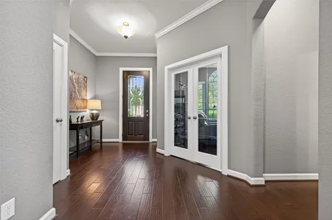 wooden floor in a hall with an entryway