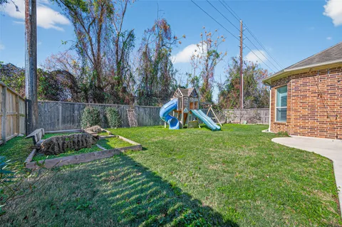 a view of a backyard with a slide