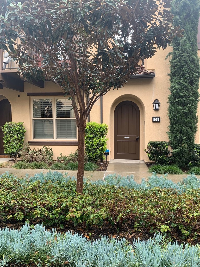 74 Granite Path Irvine, CA 92620 - Photo 1 of 1 a front view of a house with garden