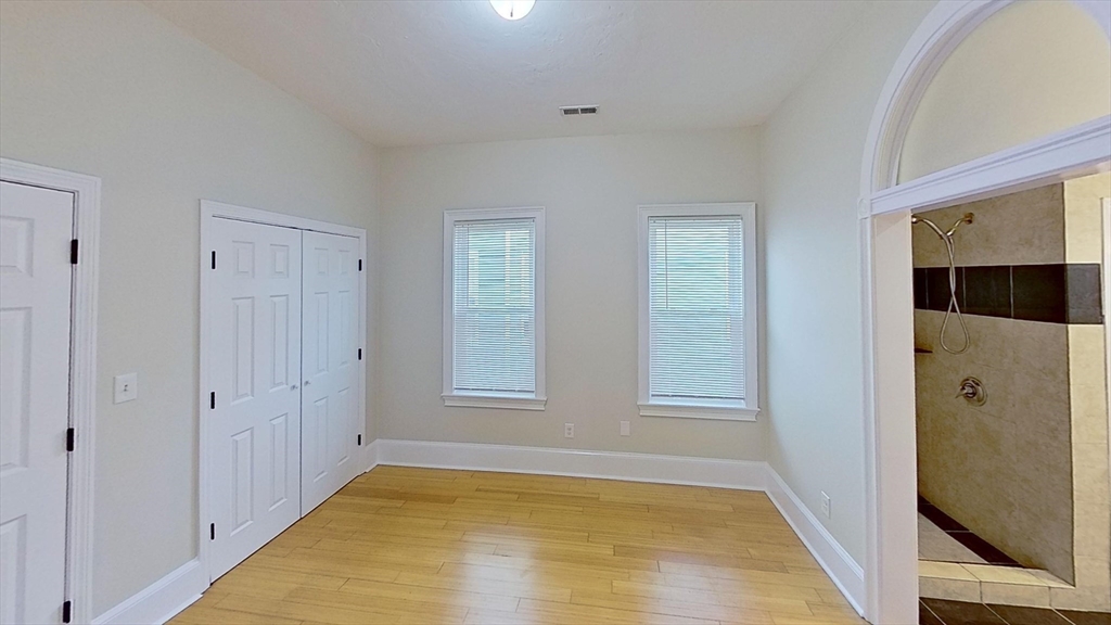 9 Landor Road, Unit 3 Boston, MA 02126 - Photo 3 of 7 a view of an empty room with window