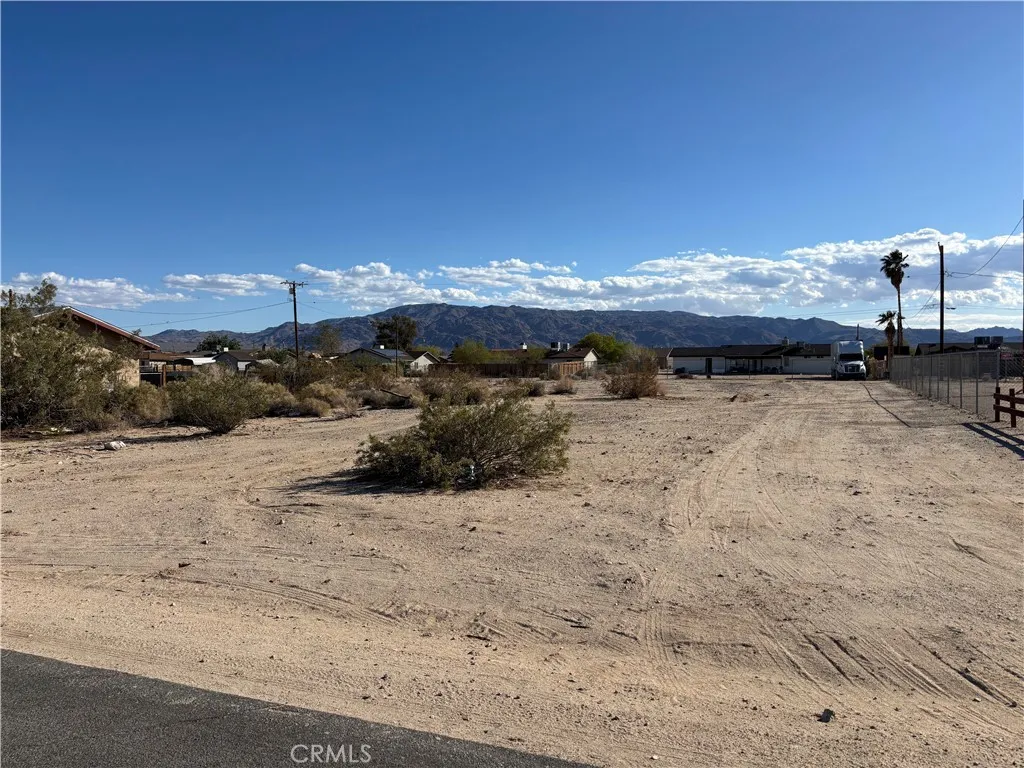 1 Flying H Road Twentynine Palms, CA 92277 - Photo 1 of 10 a view of a road with a building in the background