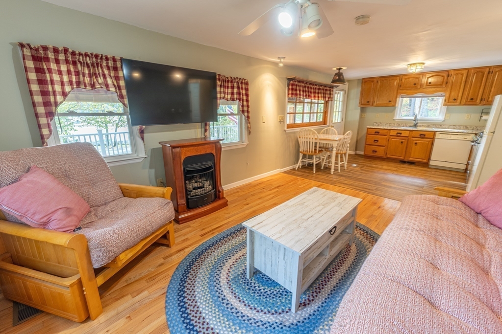 9 Chandler Road Holland, MA 01521 - Photo 16 of 42 a living room with fireplace furniture and a flat screen tv