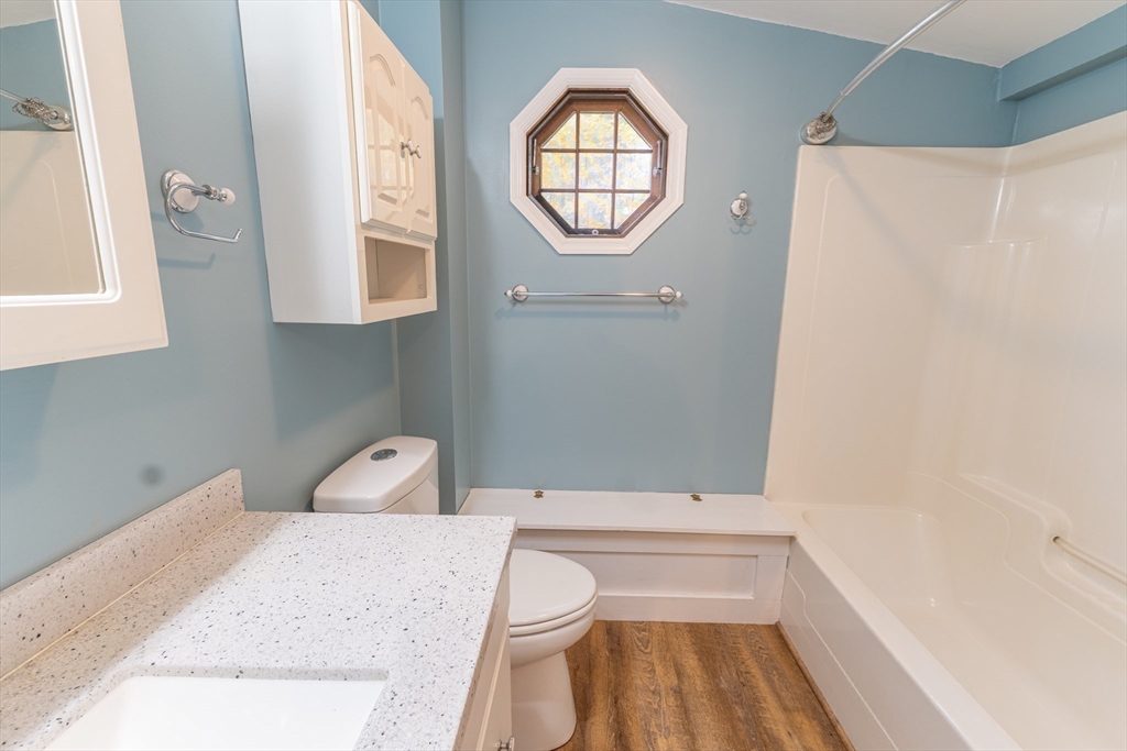 9 Chandler Road Holland, MA 01521 - Photo 22 of 42 a bathroom with a bathtub and a window