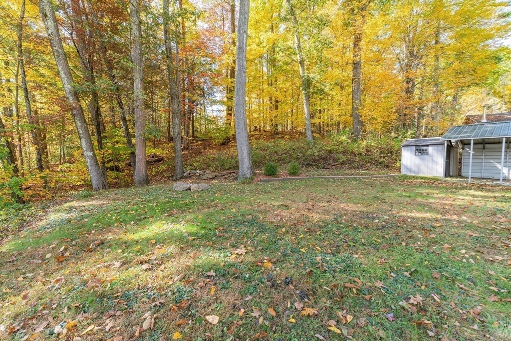 9 Chandler Road Holland, MA 01521 - Photo 26 of 42 a view of a backyard with large trees