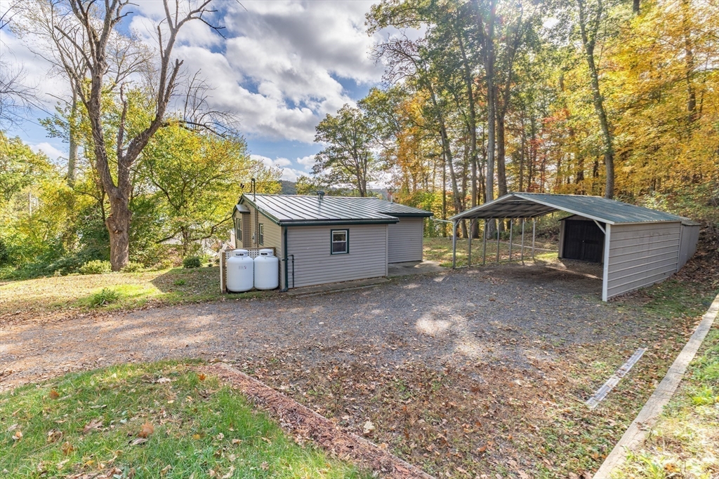 9 Chandler Road Holland, MA 01521 - Photo 31 of 42 a view of a house with a yard and garage