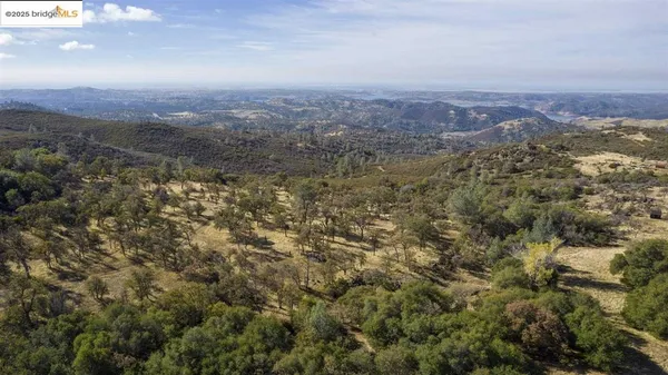 an aerial view of residential house and green space