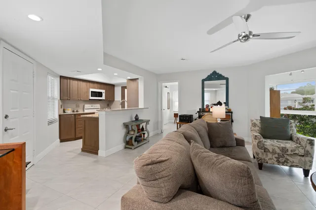 a kitchen with stainless steel appliances granite countertop a refrigerator stove and sink