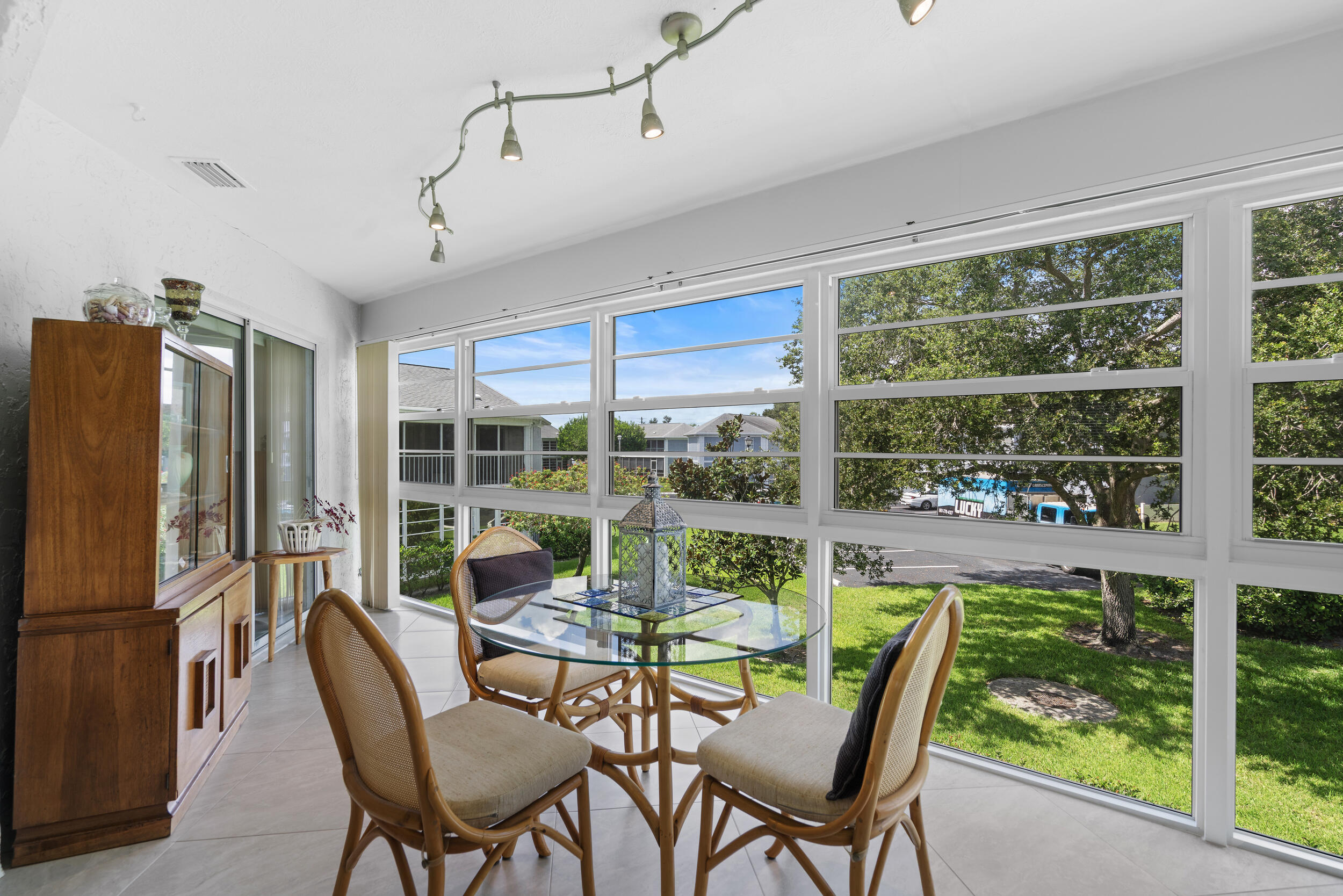 3236 Southeast Aster Lane, Unit M228 Stuart, FL 34994 - Photo 24 of 51 a dining room with furniture water view and a floor to ceiling window