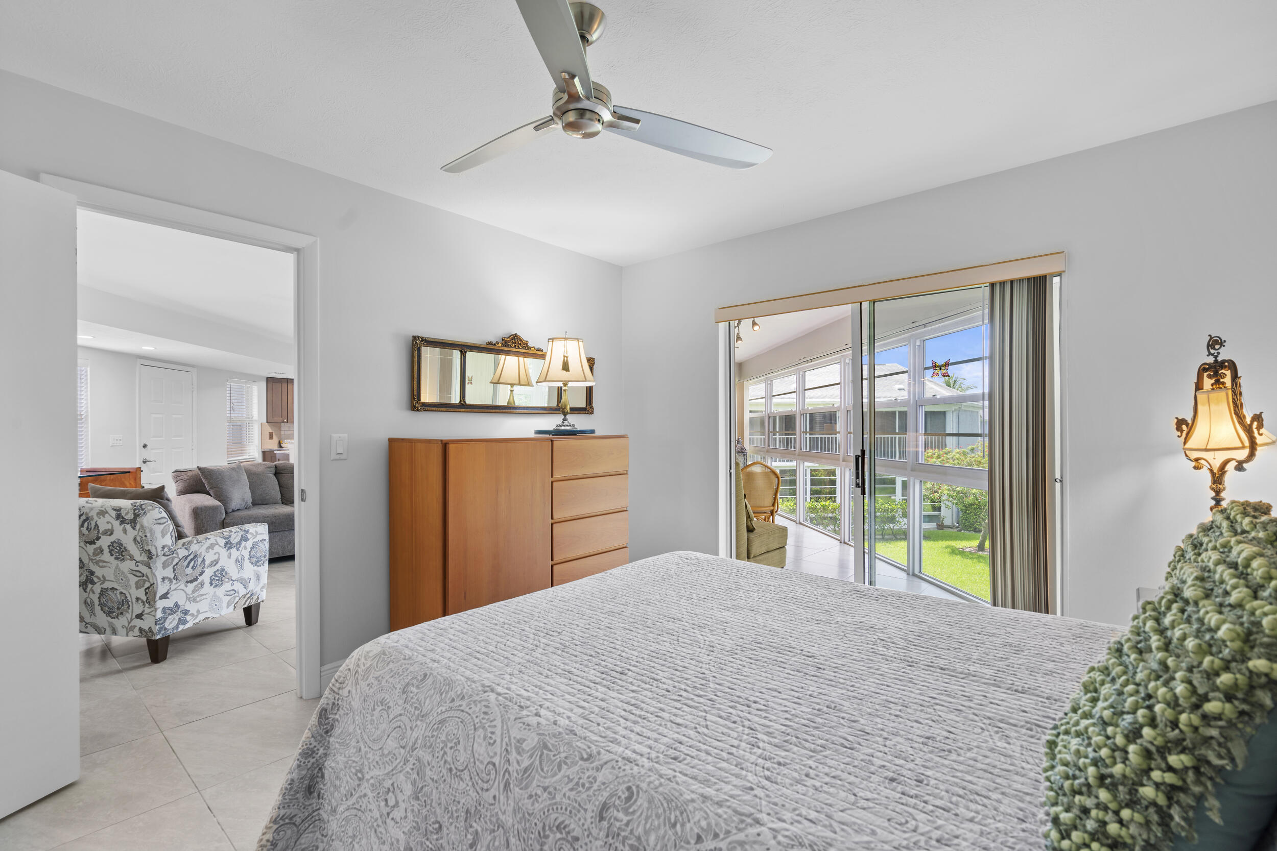 3236 Southeast Aster Lane, Unit M228 Stuart, FL 34994 - Photo 26 of 51 a bedroom with a large bed and a window