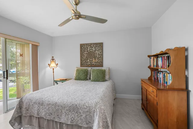 a bedroom with a bed and a book shelf