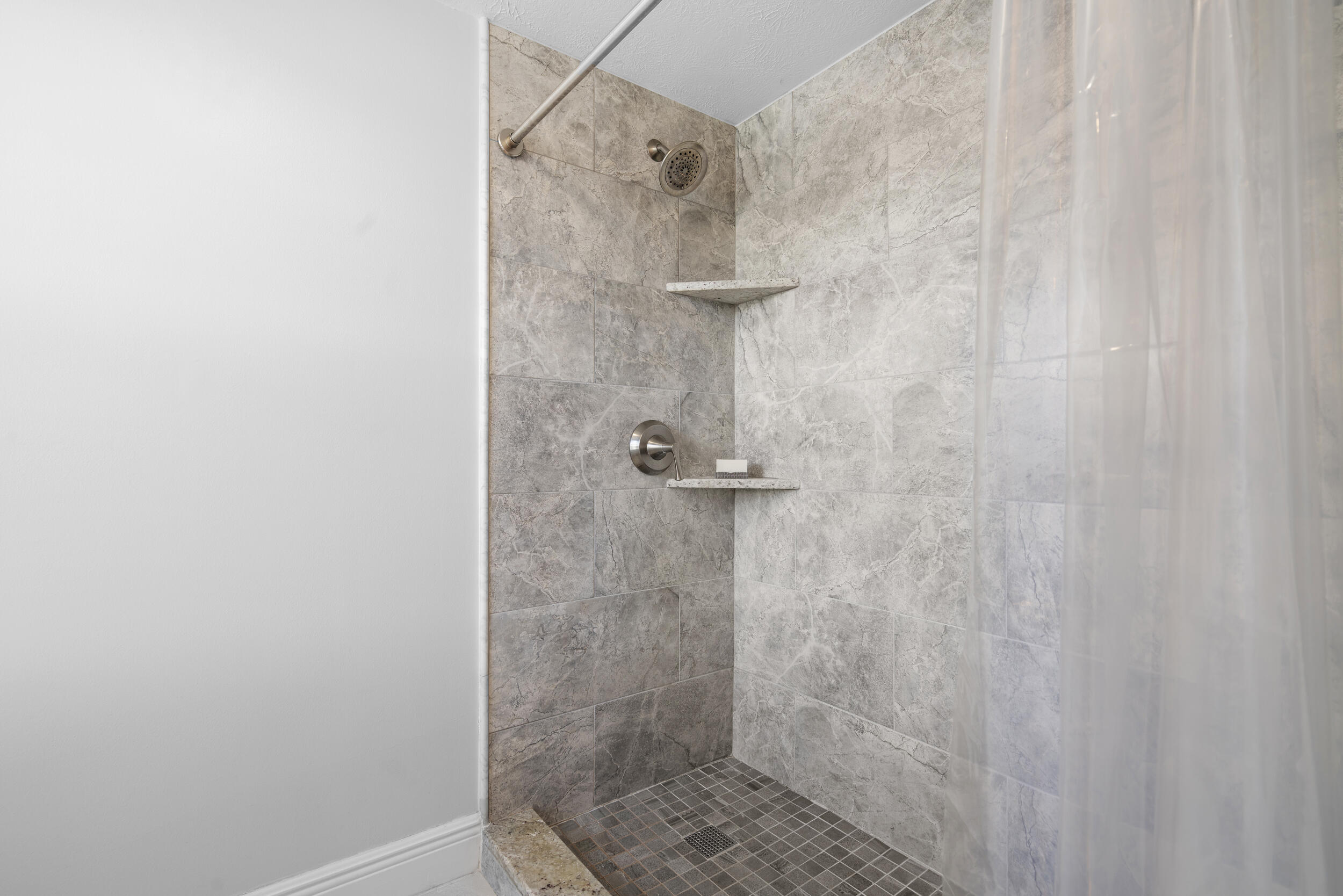 3236 Southeast Aster Lane, Unit M228 Stuart, FL 34994 - Photo 34 of 51 a bathroom with a shower