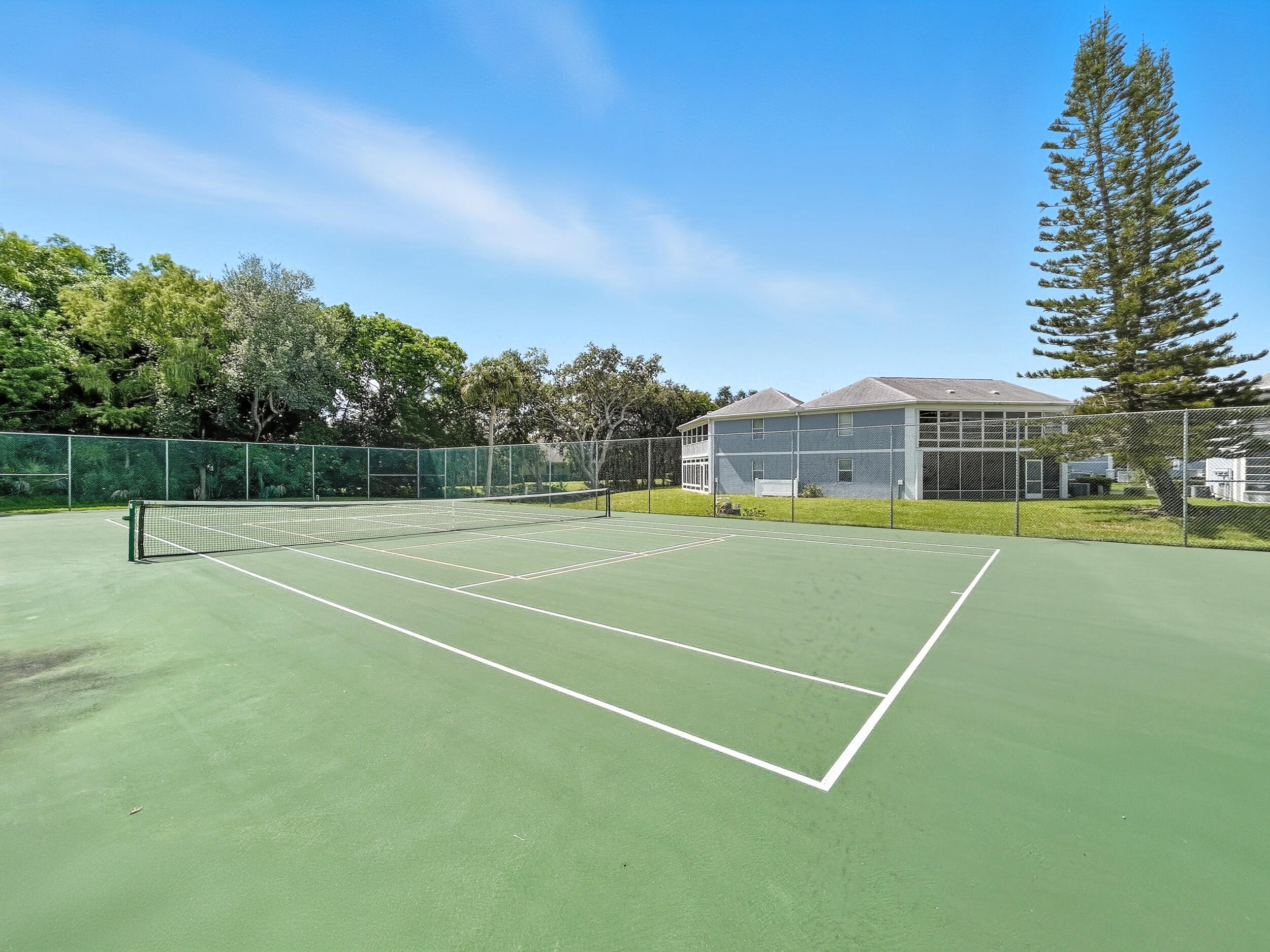 3236 Southeast Aster Lane, Unit M228 Stuart, FL 34994 - Photo 44 of 51 a view of a tennis court