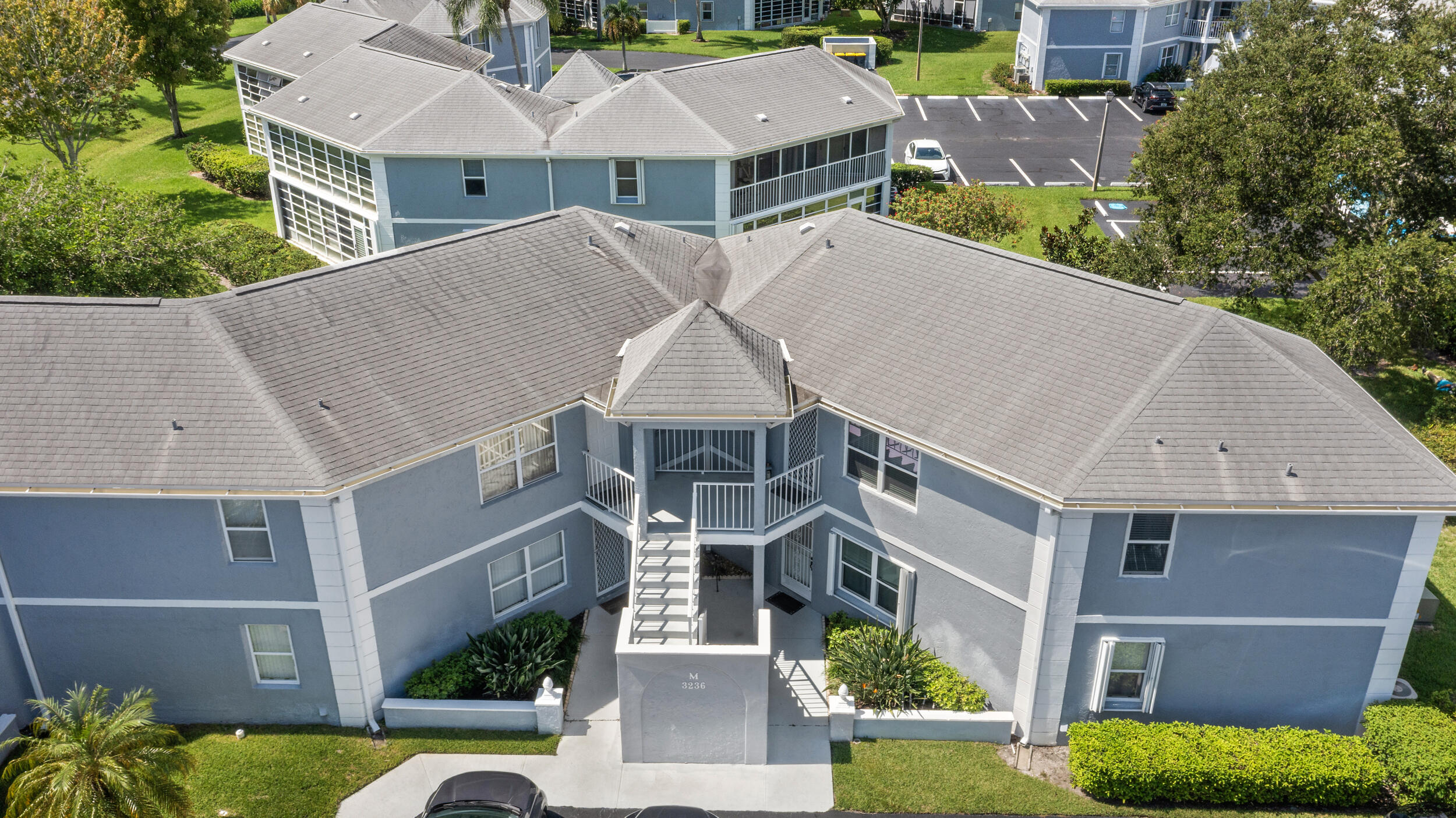 3236 Southeast Aster Lane, Unit M228 Stuart, FL 34994 - Photo 7 of 51 an aerial view of a house with a yard