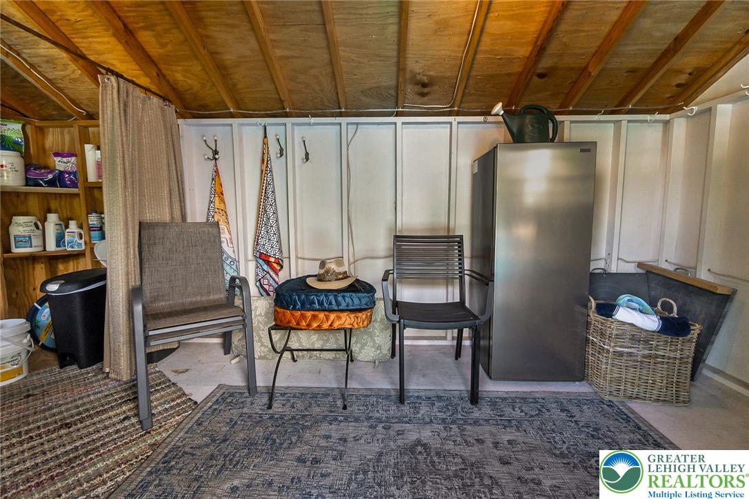 540 Briar Road Pen Argyl, PA 18072 - Photo 46 of 66 A versatile entertaining/changing space features exposed wooden ceilings and durable concrete flooring.