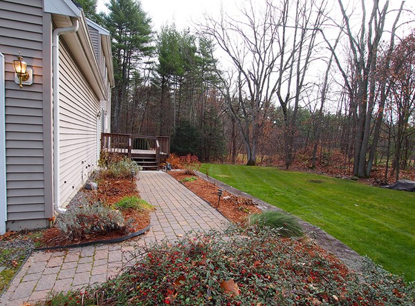107 Nashua Road Pepperell, MA 01463 - Photo 18 of 22 a backyard of a house with lots of green space