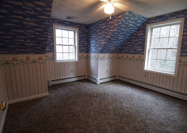 107 Nashua Road Pepperell, MA 01463 - Photo 8 of 22 an empty room with windows