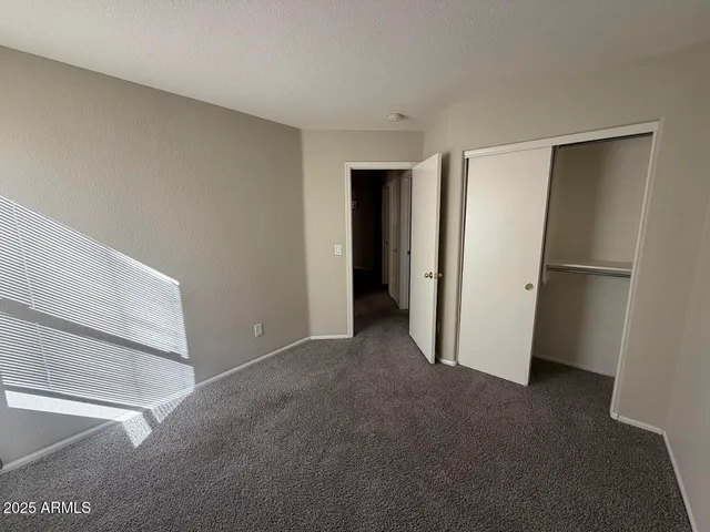 a view of empty room with closet