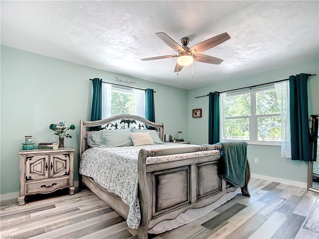 15711 Anderson Lane Fort Myers, FL 33912 - Photo 12 of 48 Large 3rd bedroom with a kingbed and ceiling fan