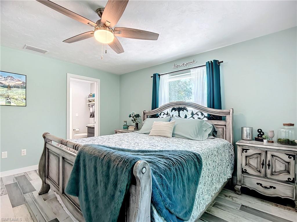 15711 Anderson Lane Fort Myers, FL 33912 - Photo 13 of 48 3rd king bedroom, a designer ceiling fan, and connected bathroom