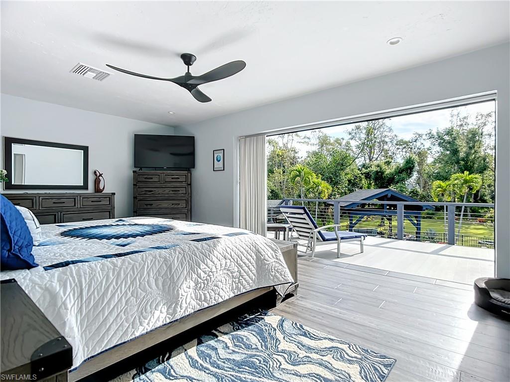 15711 Anderson Lane Fort Myers, FL 33912 - Photo 25 of 48 Primary Bedroom with sliders to connecting balcony