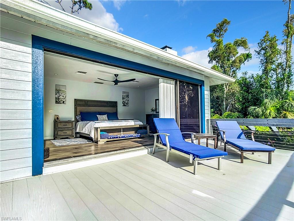 15711 Anderson Lane Fort Myers, FL 33912 - Photo 26 of 48 Primary Bedroom with doors open to the balcony