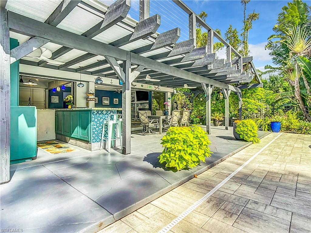 15711 Anderson Lane Fort Myers, FL 33912 - Photo 33 of 48 View of patio featuring a bar and outdoor dining area