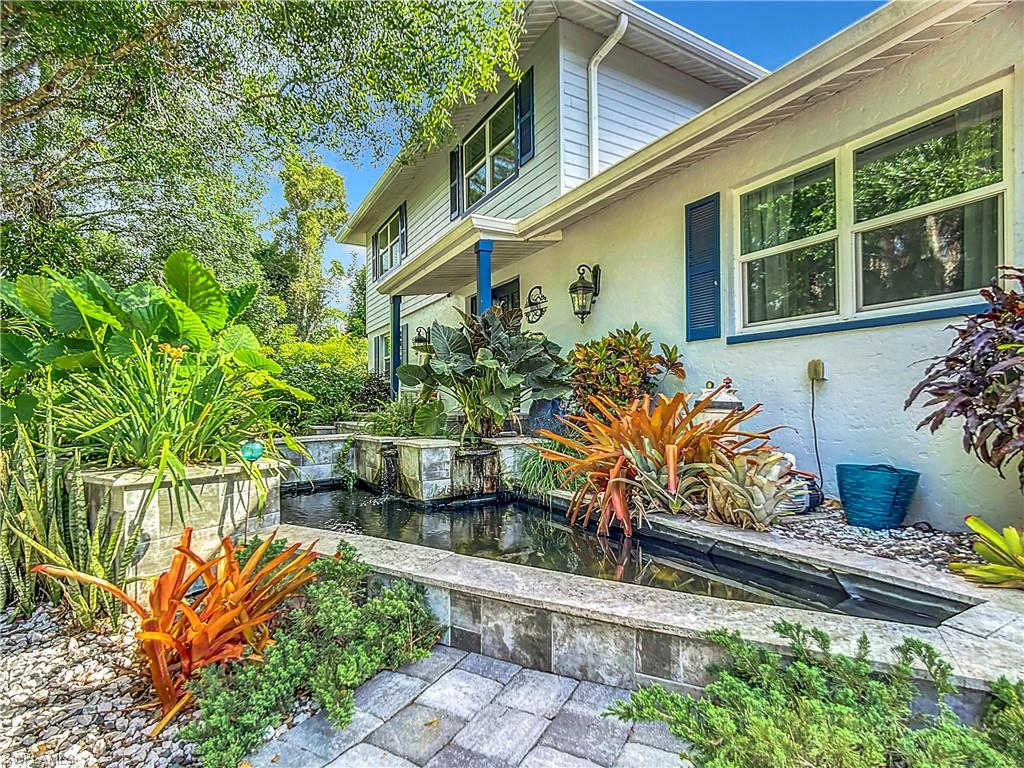 15711 Anderson Lane Fort Myers, FL 33912 - Photo 4 of 48 View of front entry featuring fish pond