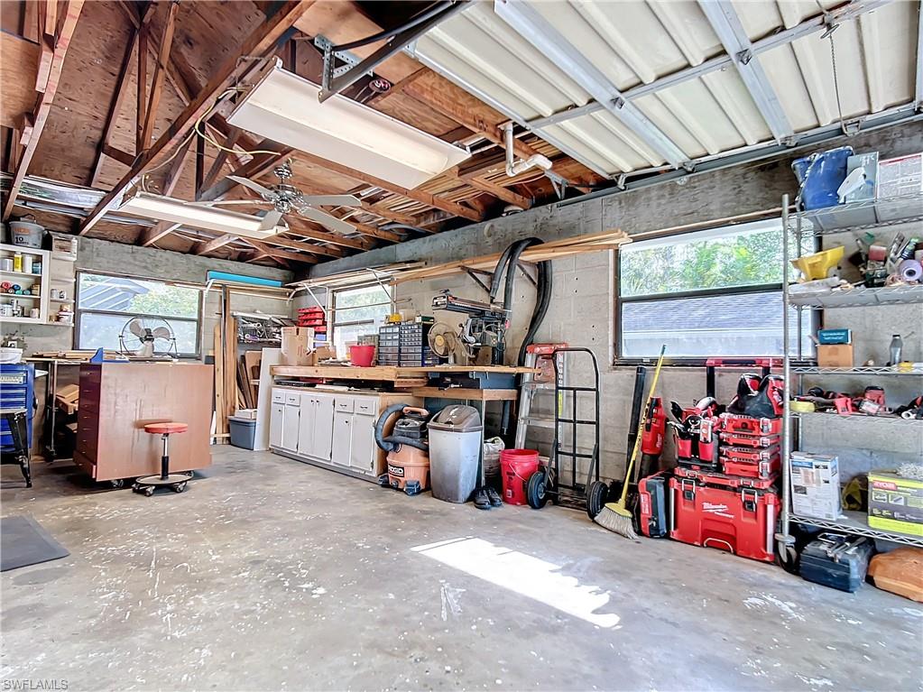 15711 Anderson Lane Fort Myers, FL 33912 - Photo 41 of 48 Garage shop/motorcycle/ golf cart additional back garage area