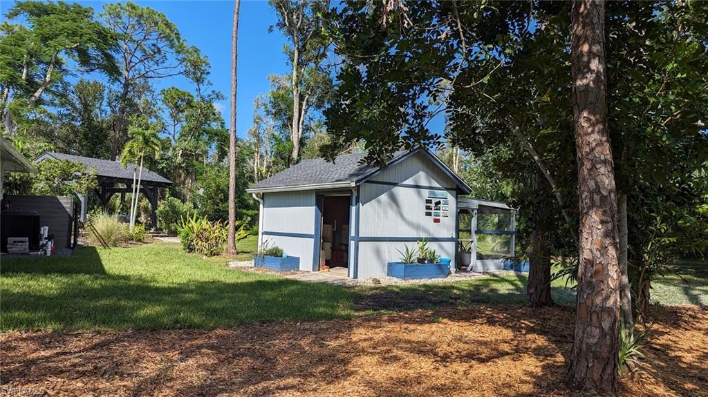 15711 Anderson Lane Fort Myers, FL 33912 - Photo 46 of 48 View of water shed with a back chicken coop if you want to have some breakfast