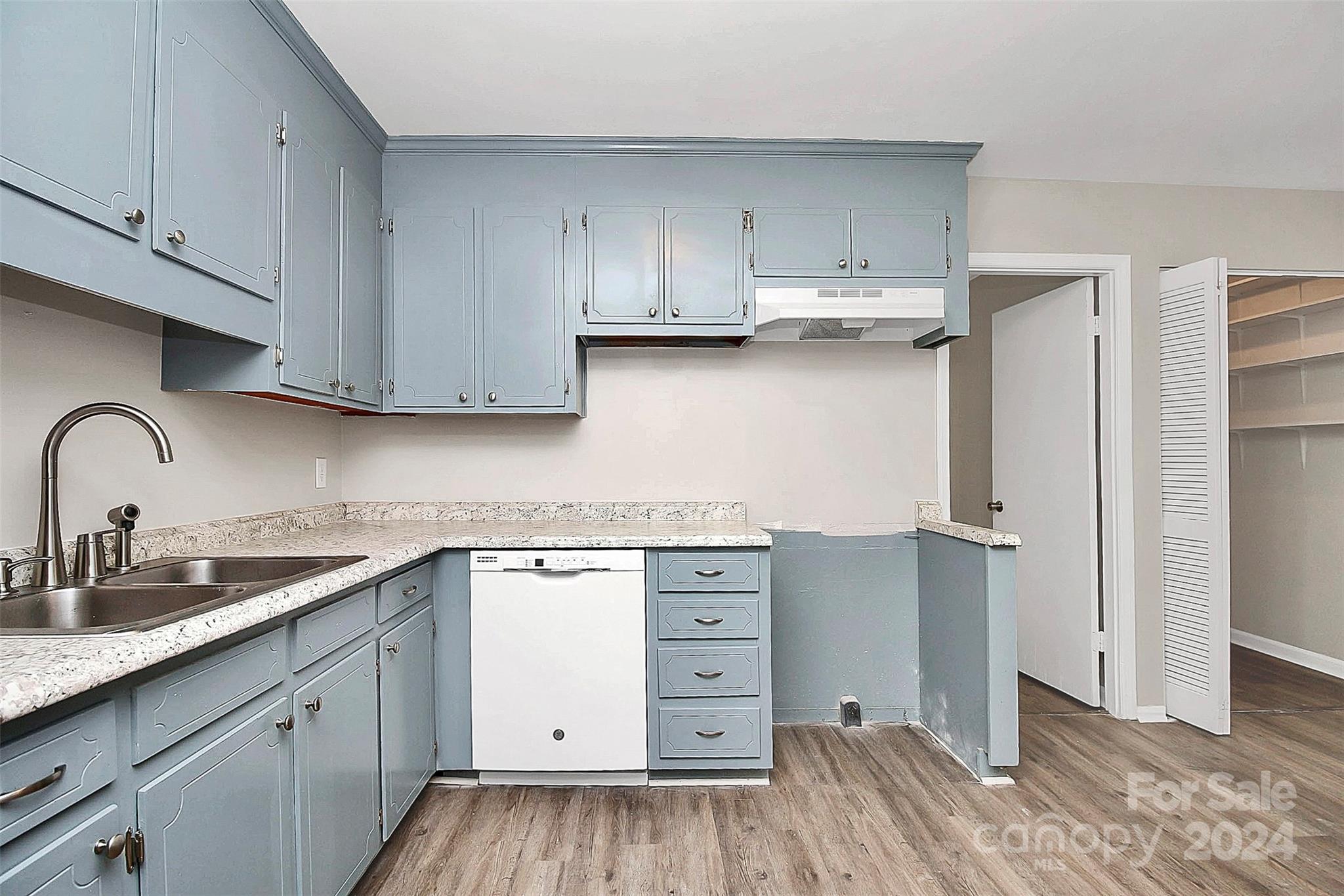 1120 Claremont Road Charlotte, NC 28214 - Photo 11 of 37 a kitchen with cabinets appliances and a sink