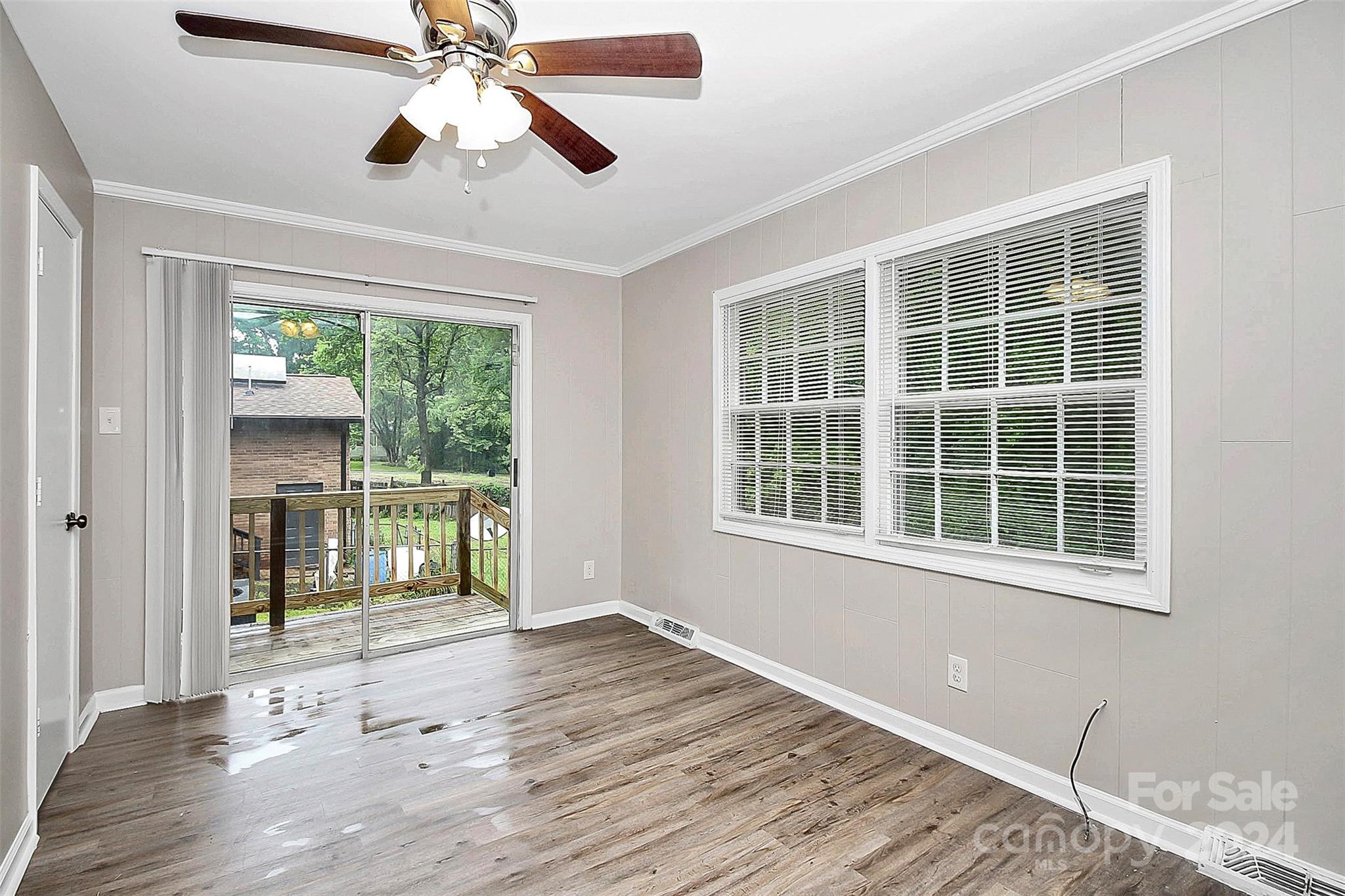 1120 Claremont Road Charlotte, NC 28214 - Photo 13 of 37 a view of an empty room with wooden floor and a window