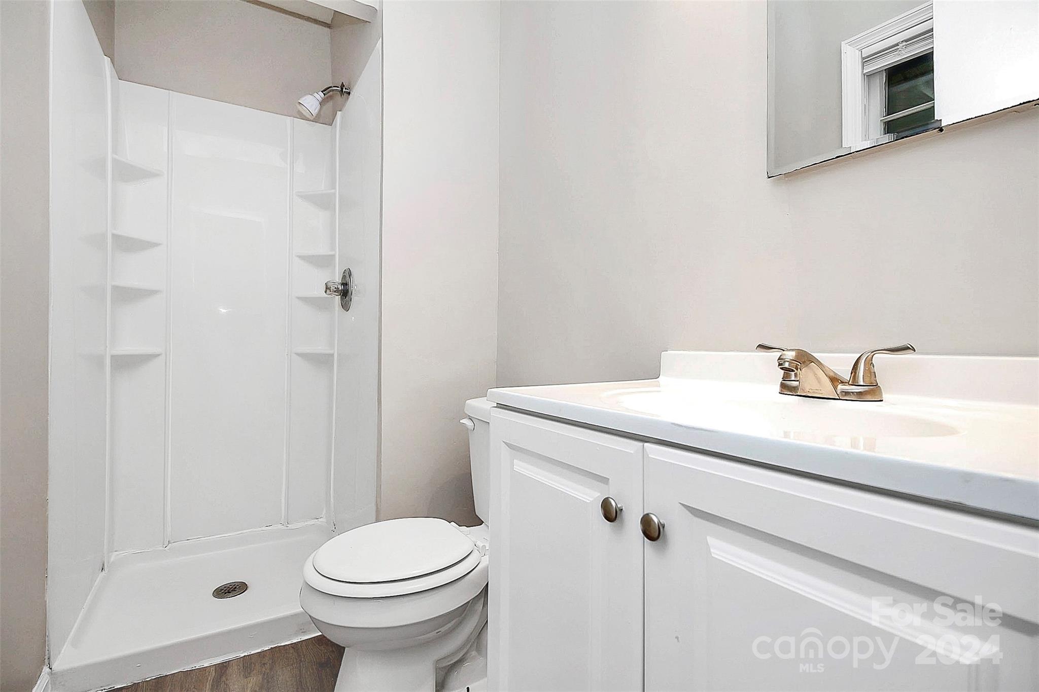 1120 Claremont Road Charlotte, NC 28214 - Photo 23 of 37 a bathroom with a sink toilet and shower