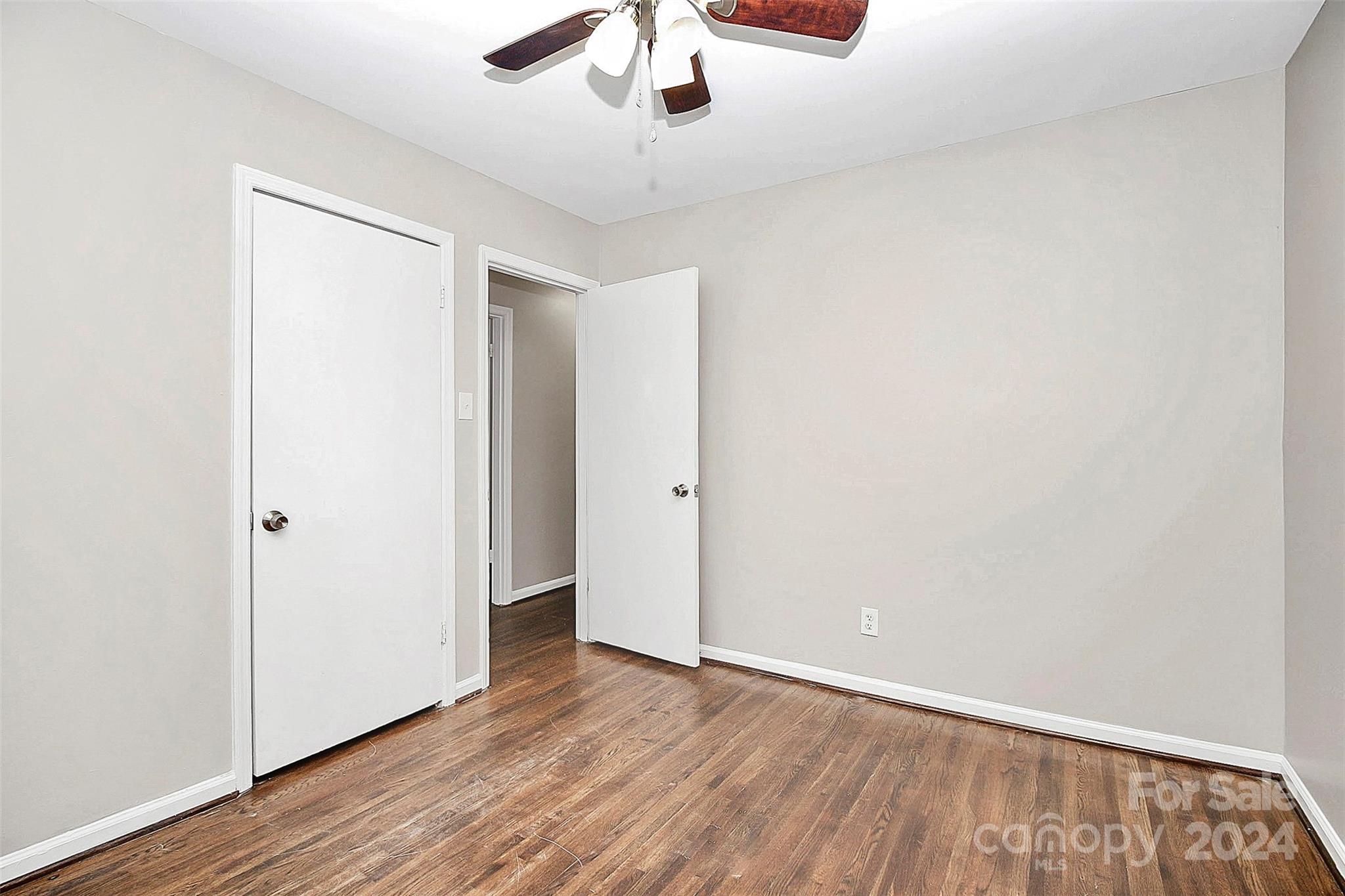1120 Claremont Road Charlotte, NC 28214 - Photo 26 of 37 a view of an empty room with wooden floor