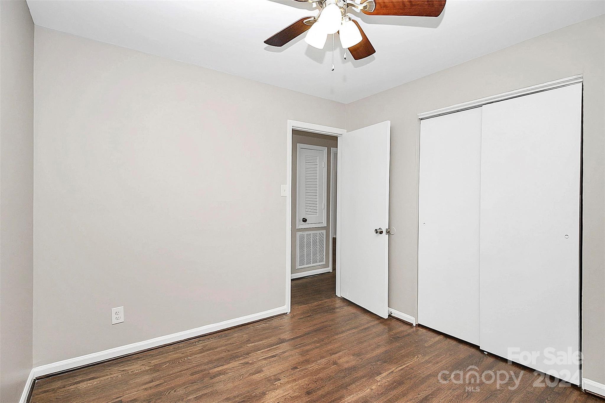 1120 Claremont Road Charlotte, NC 28214 - Photo 28 of 37 a view of an empty room with wooden floor