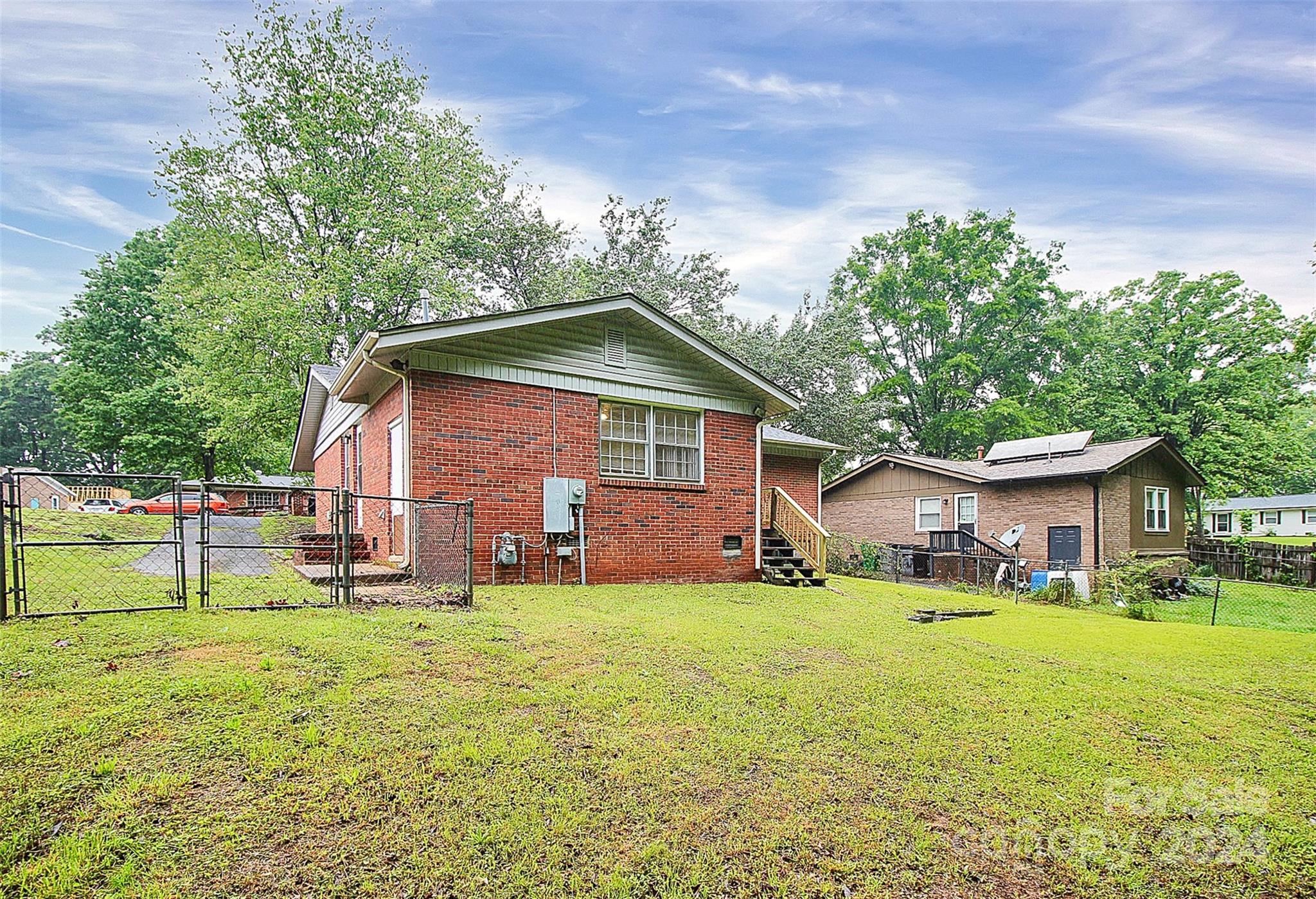 1120 Claremont Road Charlotte, NC 28214 - Photo 32 of 37 a front view of house with yard and green space