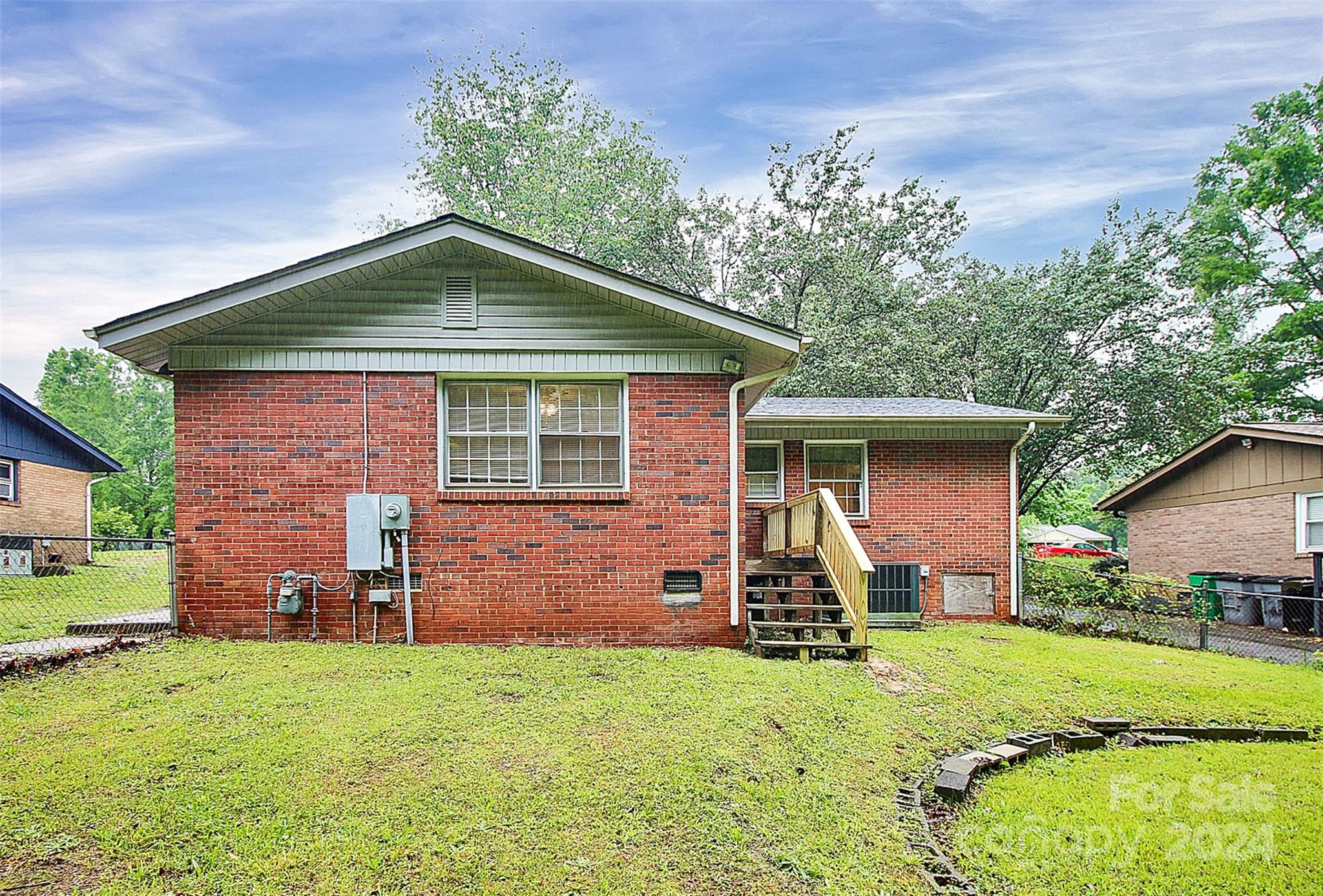 1120 Claremont Road Charlotte, NC 28214 - Photo 34 of 37 front view of a house with a yard