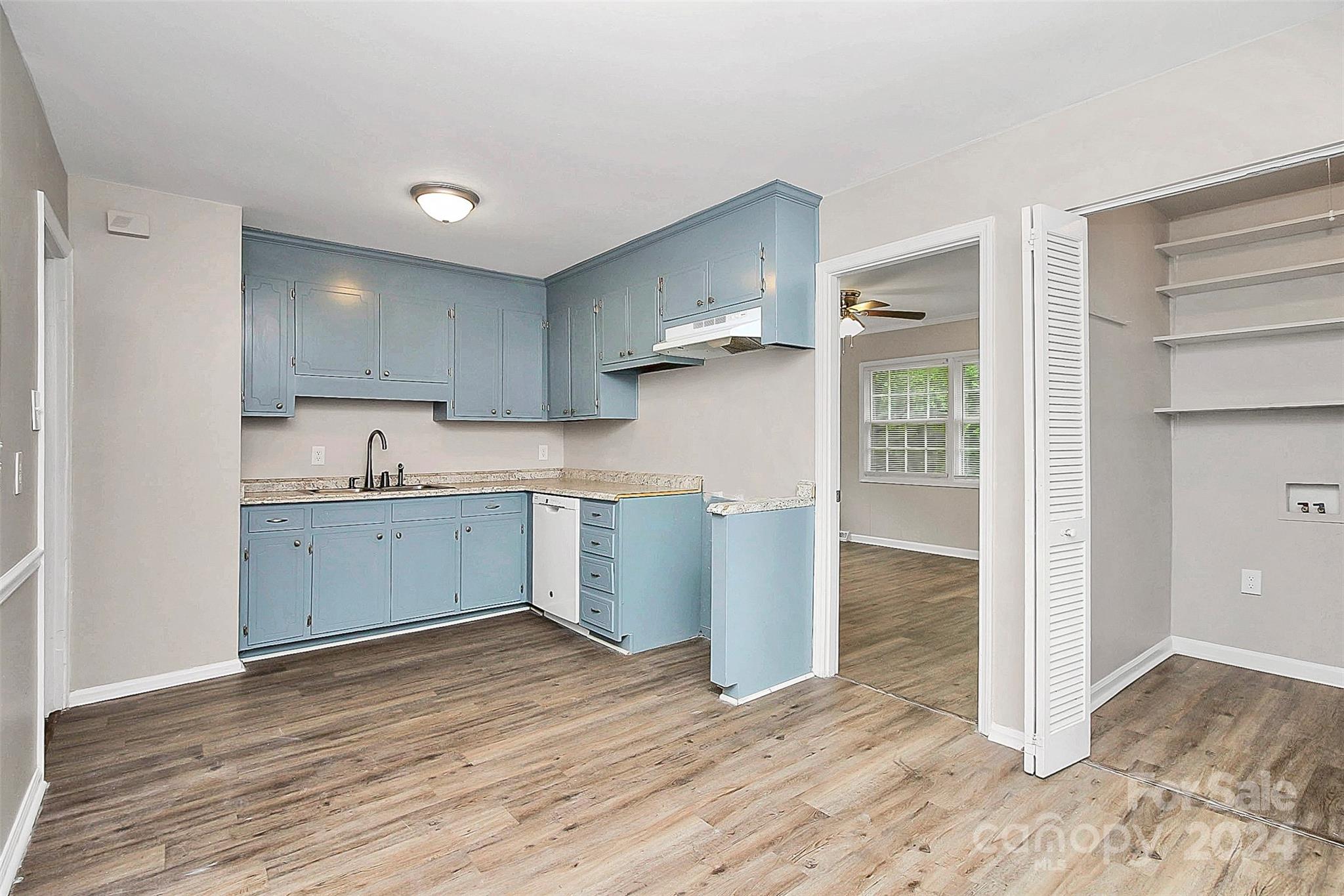 1120 Claremont Road Charlotte, NC 28214 - Photo 7 of 37 a kitchen with granite countertop a stove a refrigerator and a sink