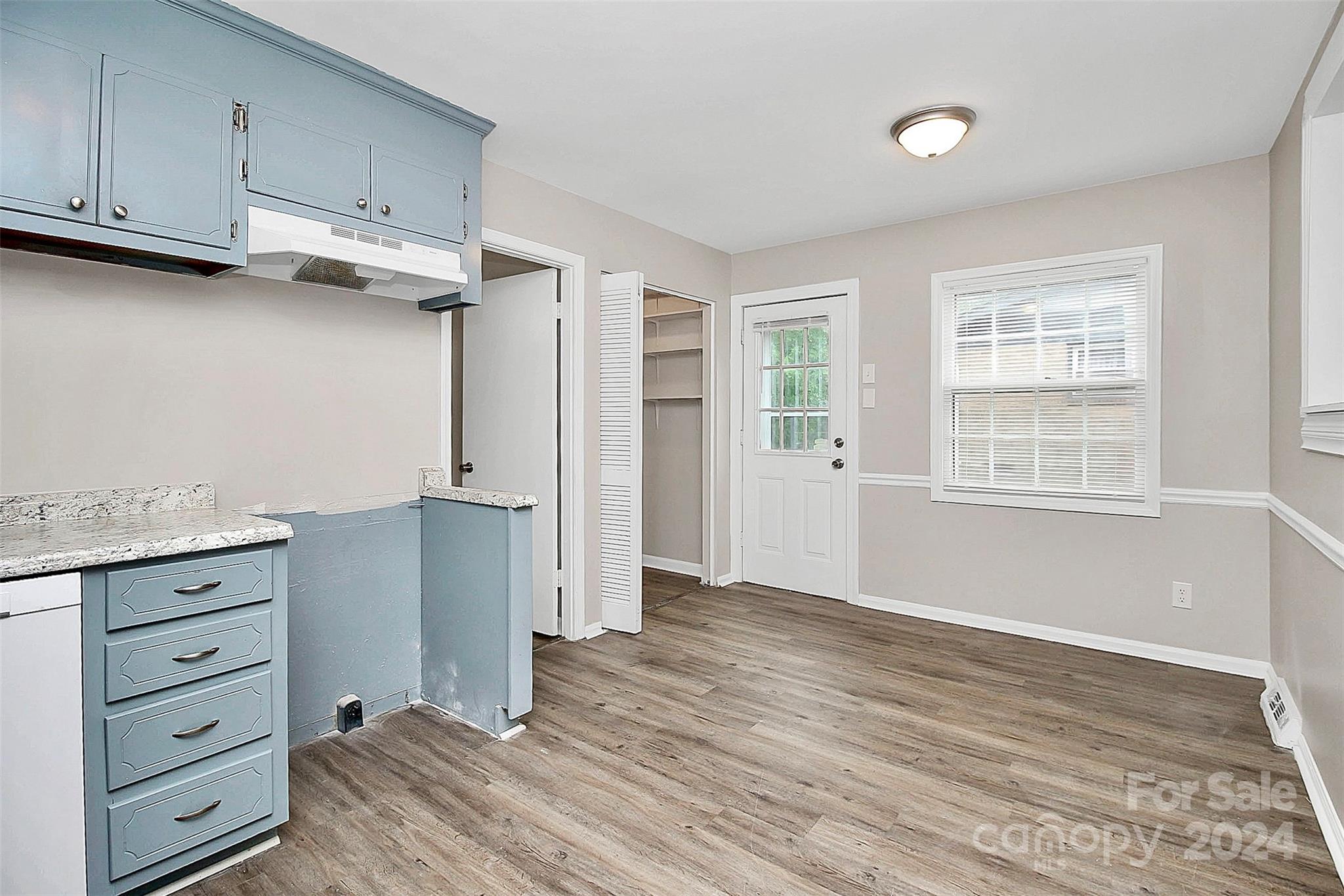 1120 Claremont Road Charlotte, NC 28214 - Photo 8 of 37 a view of cabinets and wooden floor