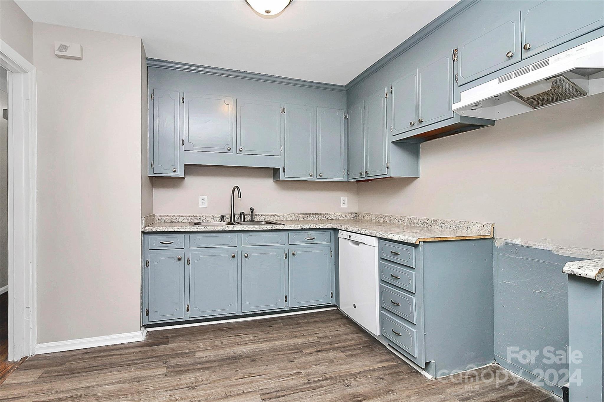1120 Claremont Road Charlotte, NC 28214 - Photo 10 of 37 a kitchen with granite countertop cabinets stainless steel appliances and a sink
