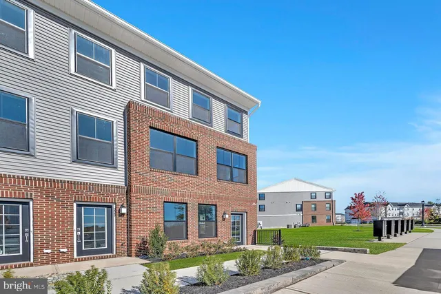 a front view of a building with garden
