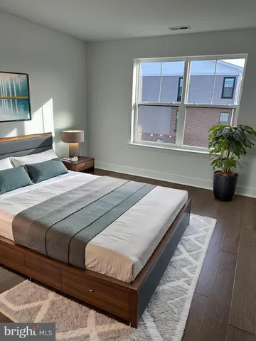 a bedroom with a bed and window