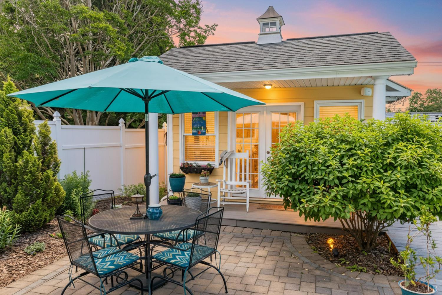 232 Elon Road Madison Heights, VA 24572 - Photo 38 of 65 Charming pool house overlooking the patio and pool area, perfect for relaxing or storing pool essentials.