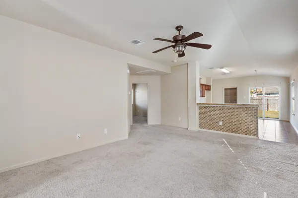 a view of a livingroom with a ceiling fan