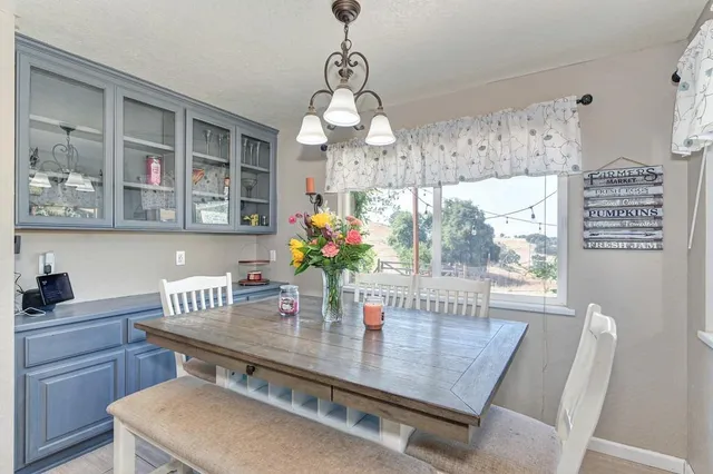 a dining room with furniture and window