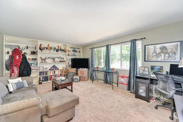 a view of a patio with table and chairs and potted plants