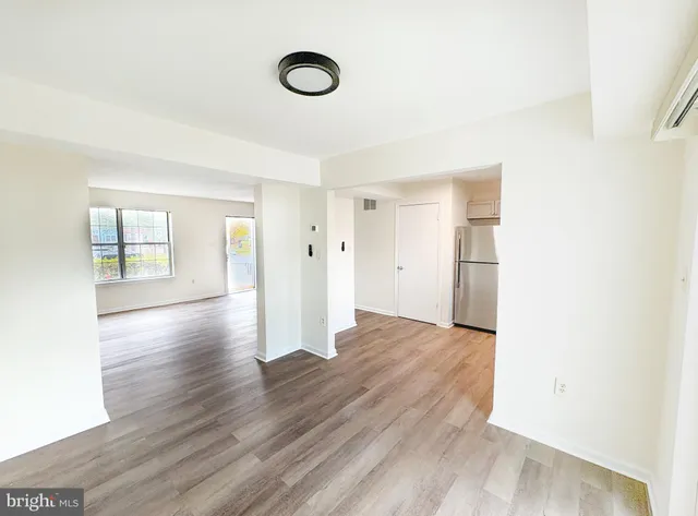 a view of a livingroom with wooden floor