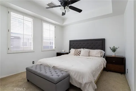 a bedroom with bed and window