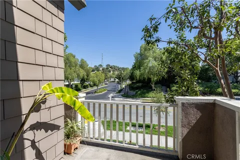 a view of street from balcony